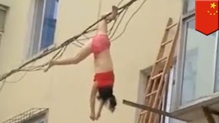 Defying Death Woman dangles from power line  TomoNews [upl. by Blondy]